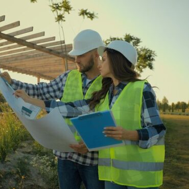 caucasian-contractors-engineers-colleagues-female-woman-engineer-inspector-write-report-hardhat-male_717737-20121